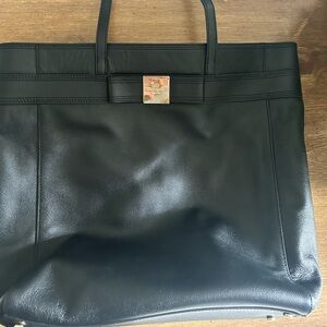 Kate Spade black leather tote. With Kate spade card. Like new.